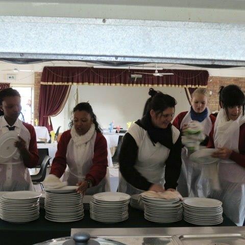 RCL members making breakfast at an old age home with the Lions of SA (Roodepoort) - May 2013